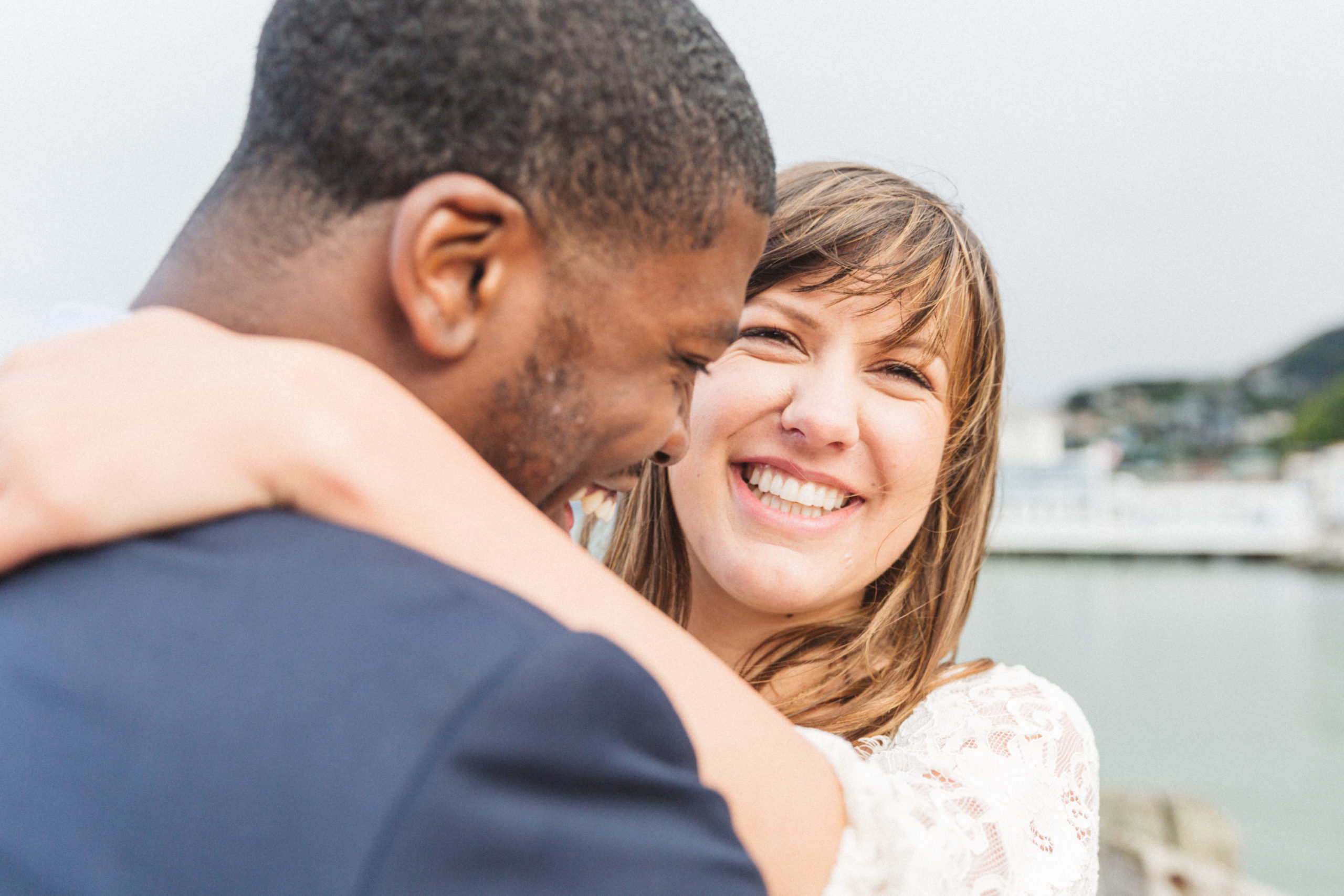 sausalito engagement photos by the water with woman laughing