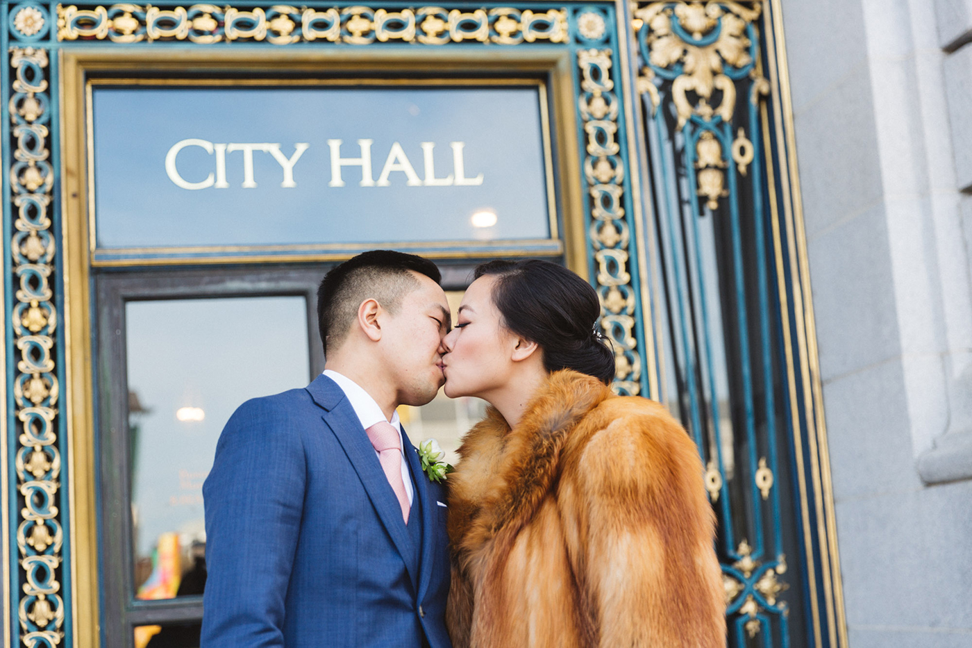 just married couple kissing outside city hall photography