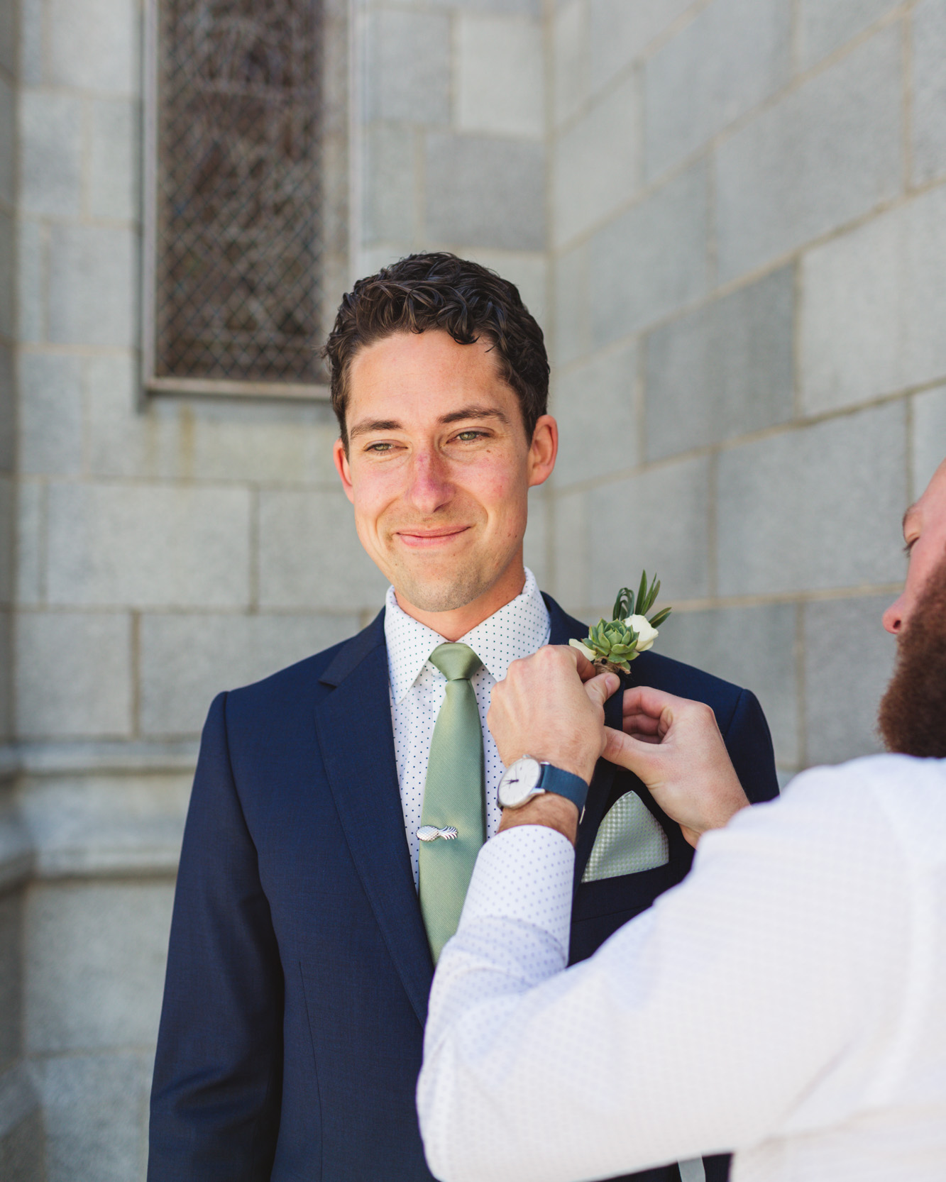 san francisco groom boutonniere pinning outside church