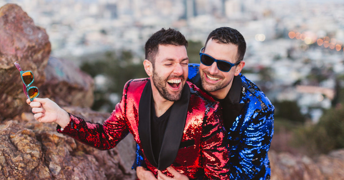 joyful and fun corona heights engagement with gay male couple in matching sequin jackets