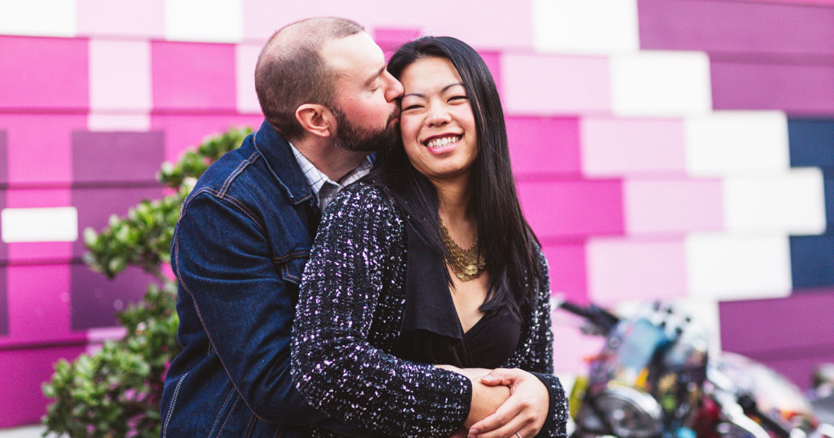 balmy alley engagement photos near pink mural