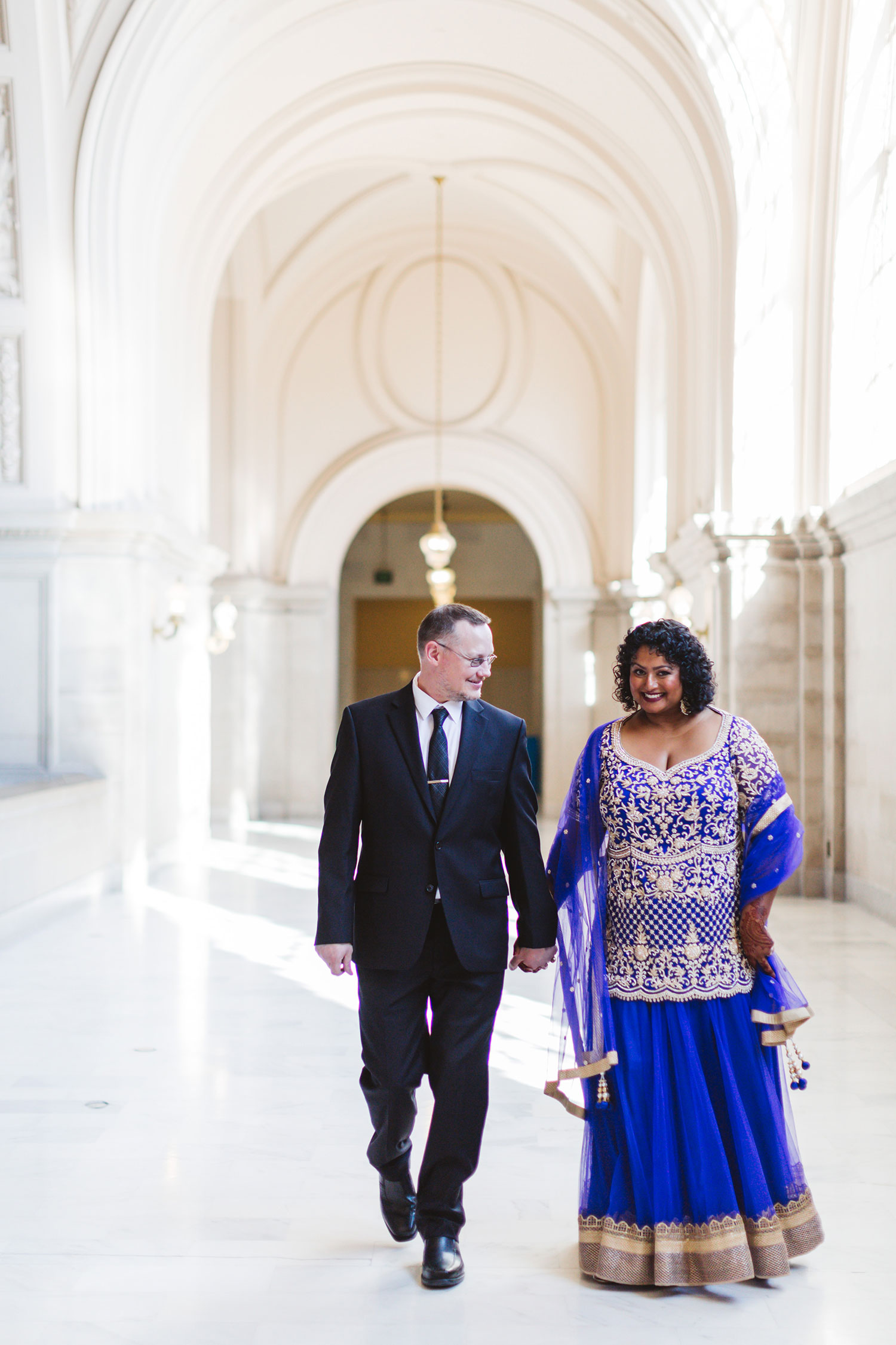 formal elegant city hall wedding couple walking in 4th floor gallery