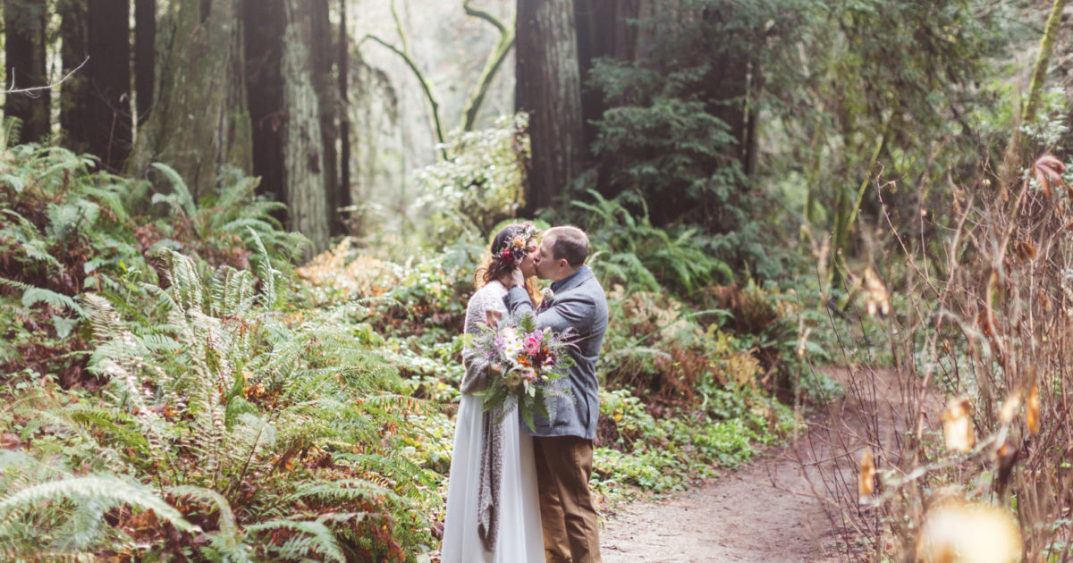 couple kissing at forest of nisene marks wedding in santa cruz redwoods