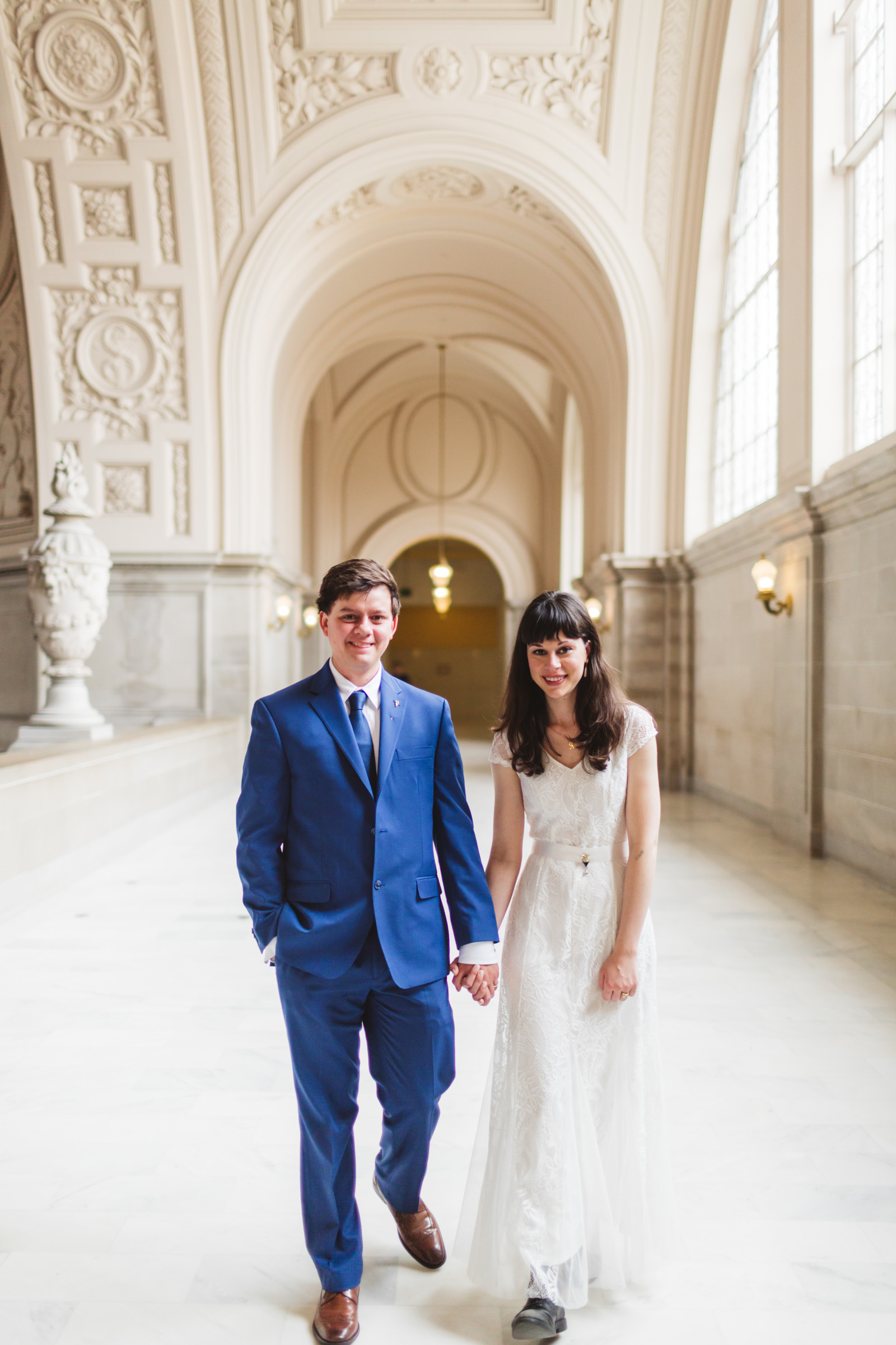 couple strolling on 4th floor of city hall san francisco