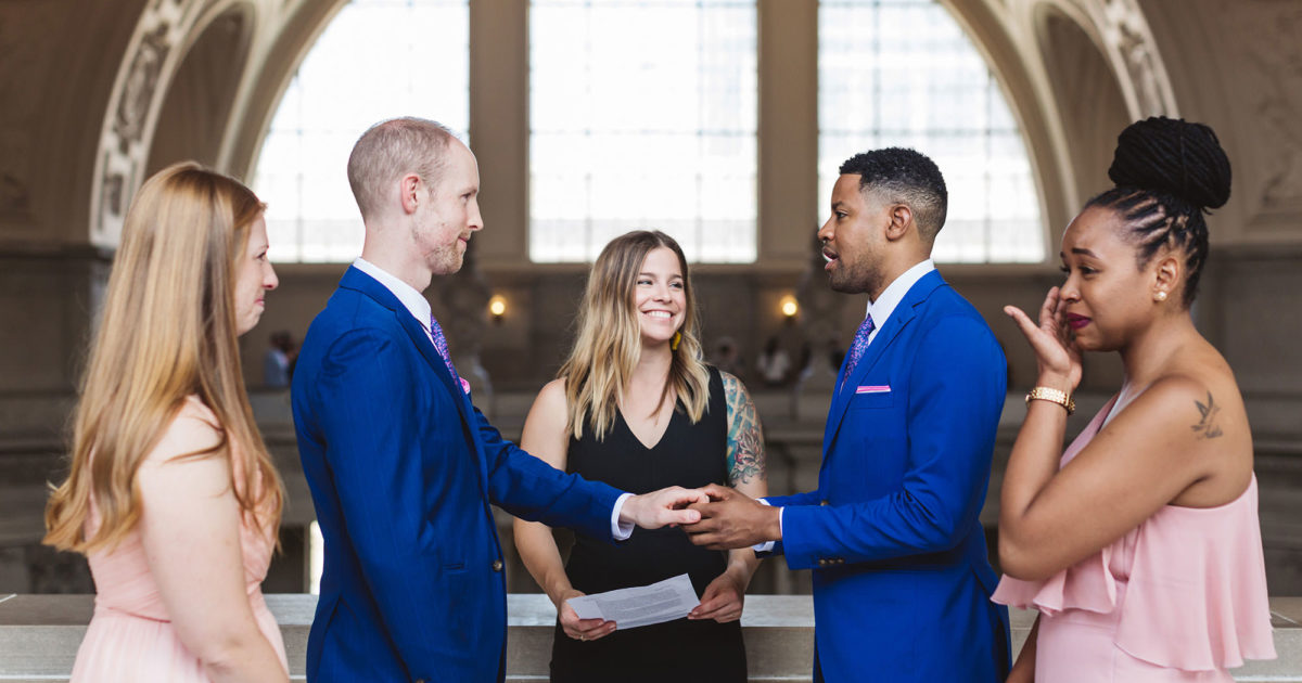 2 grooms wedding ceremony at LGBTQ+ City Hall wedding on 4th floor