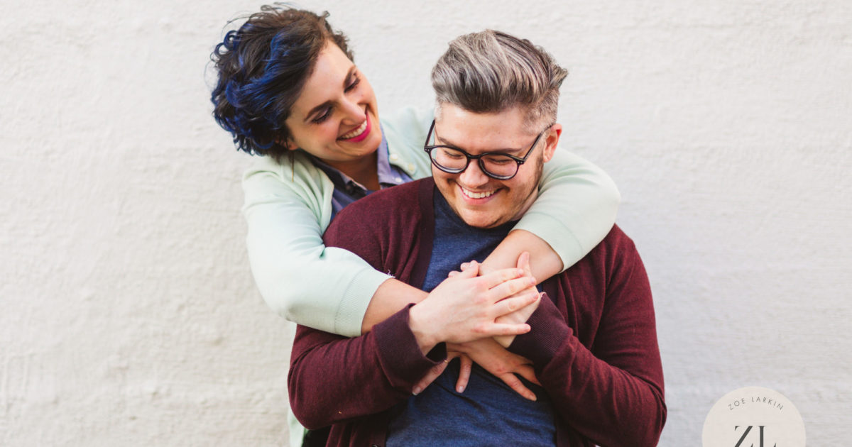 🏳️‍🌈 Totally rad engagement shoot in downtown oakland with this queer-forward Oakland couple. 🌈 Renee, Jack and I frolicked in their home while they spun some records with their large cats, then around their neighborhood. 🦄 After crossing rainbow crosswalks we finished up at the Fox Theater's iconic Oakland sign - a must-take for your Oakland engagement shoot! | #queerforward #oakland #engagementphotos #lgbtq | Zoe Larkin Photography