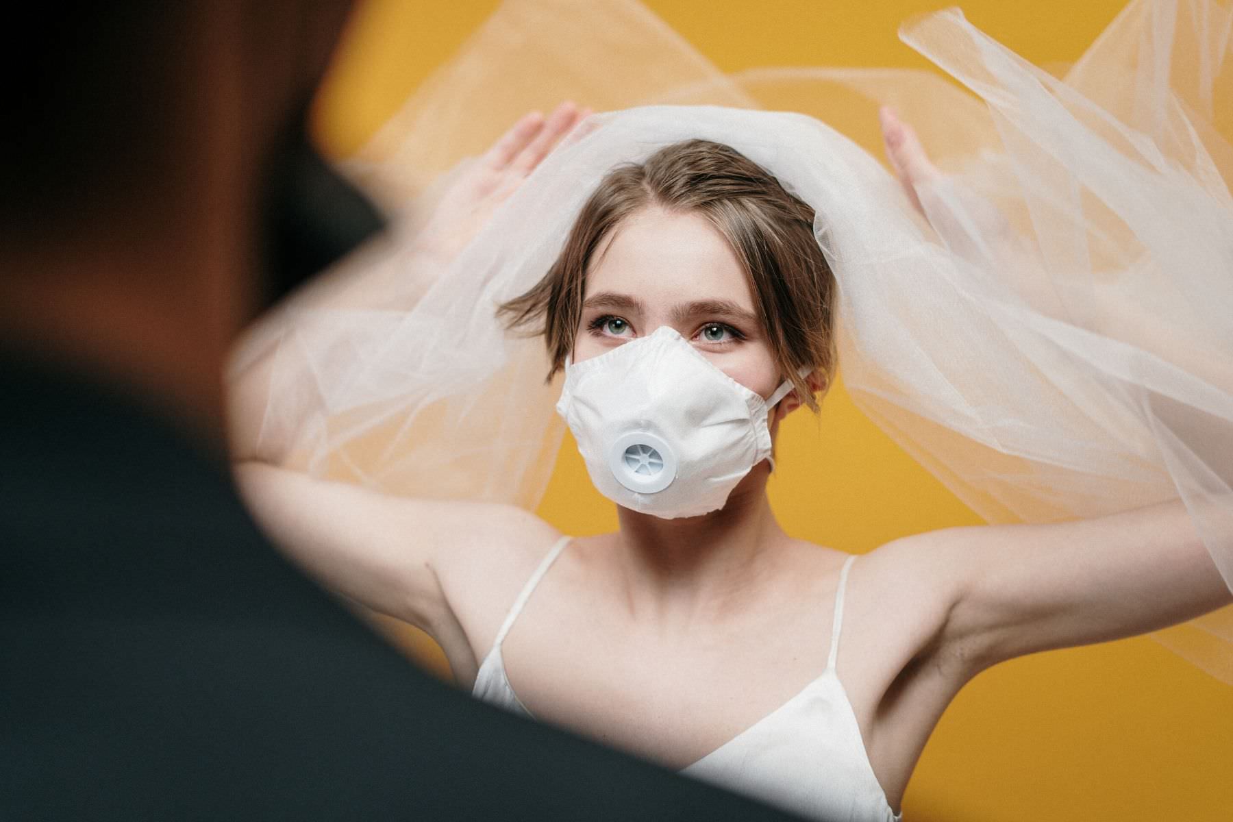 what a photographer is doing about covid weddings - bride and groom wearing masks | Zoe Larkin Photography