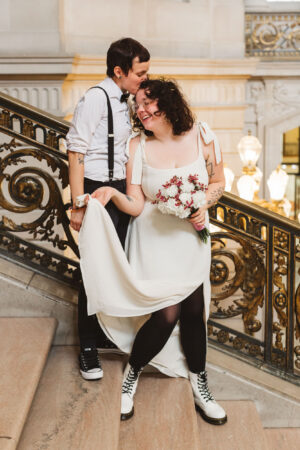 lesbian couple on grand staircase of sf city hall
